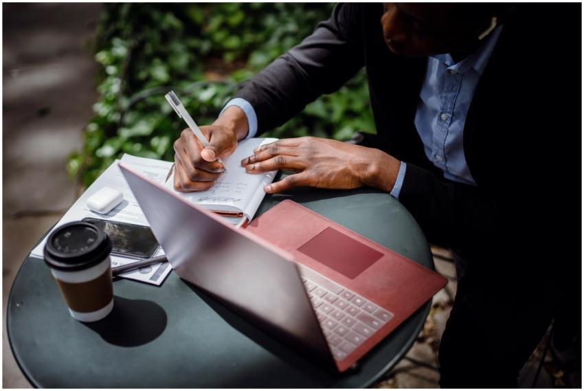 From above of crop black male journalist in formal