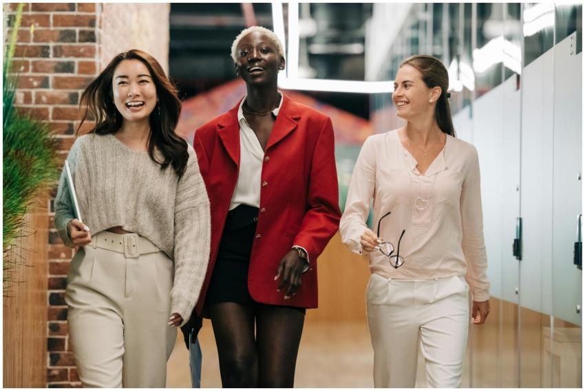Three diverse and confident businesswomen walking