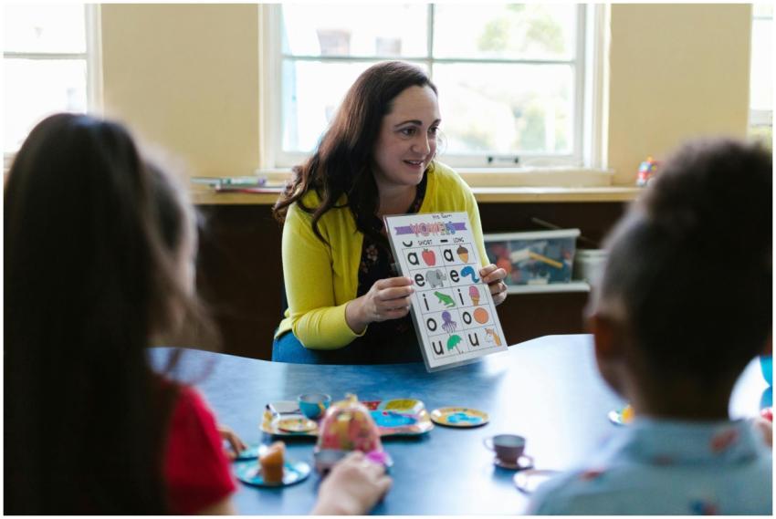 Teacher engaging young children in a fun learning