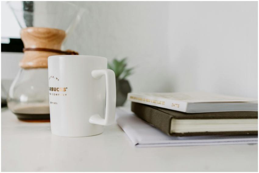 A serene workspace featuring coffee, books, and a