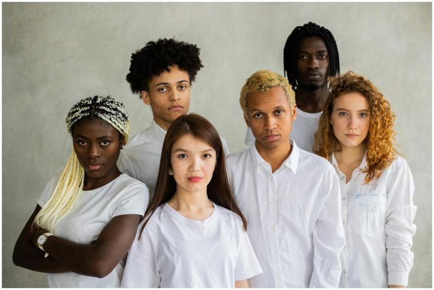 Serious diverse multiracial people standing close