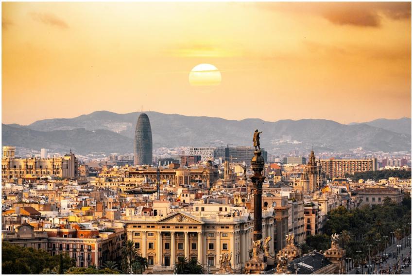 A stunning sunset view of the Barcelona skyline sh