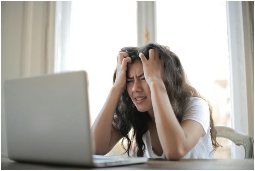 Frustrated woman struggling with remote work stres