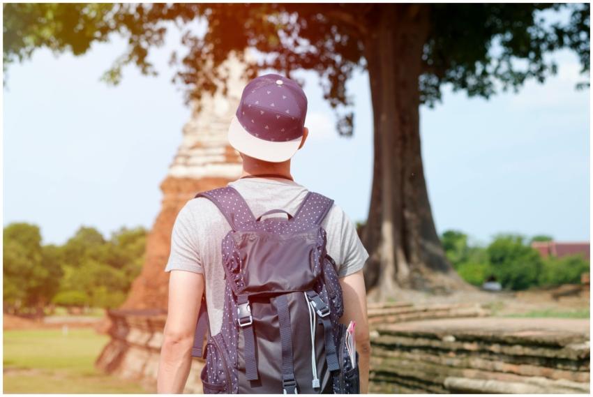 A young backpacker explores the ancient temple rui