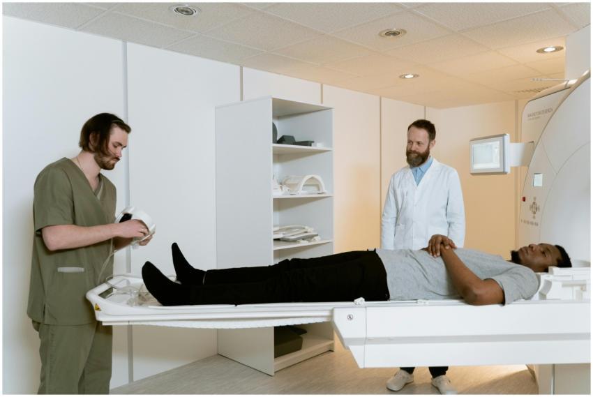 Doctors and patient during MRI scan in medical fac