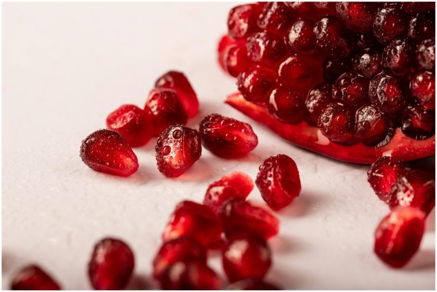 Vibrant close-up of juicy pomegranate seeds with d