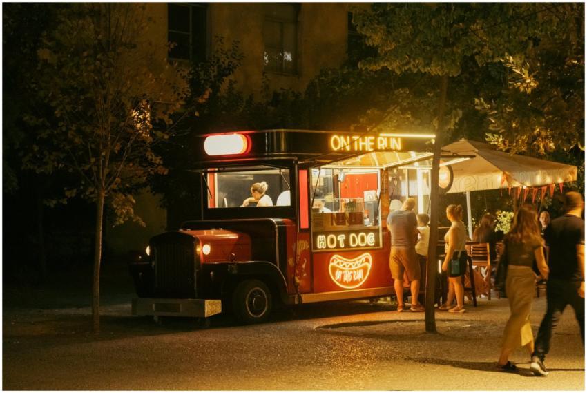 Vibrant night scene of a street food truck serving