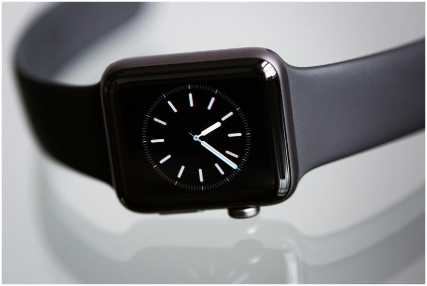 Close-up of an elegant black smartwatch with a min