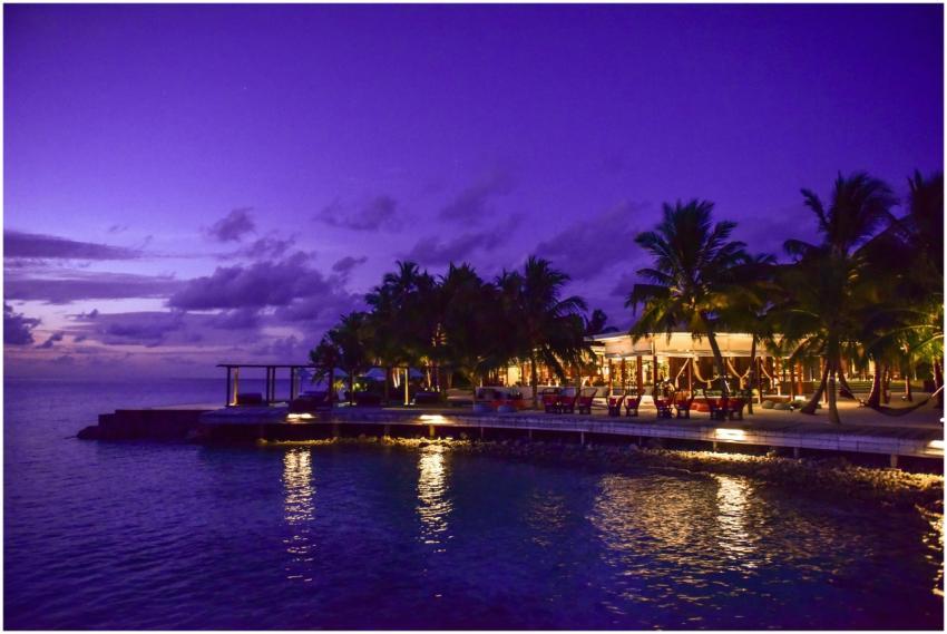 A breathtaking view of a tropical resort at twilig