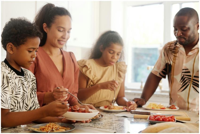A happy family sharing a meal at home, emphasizing