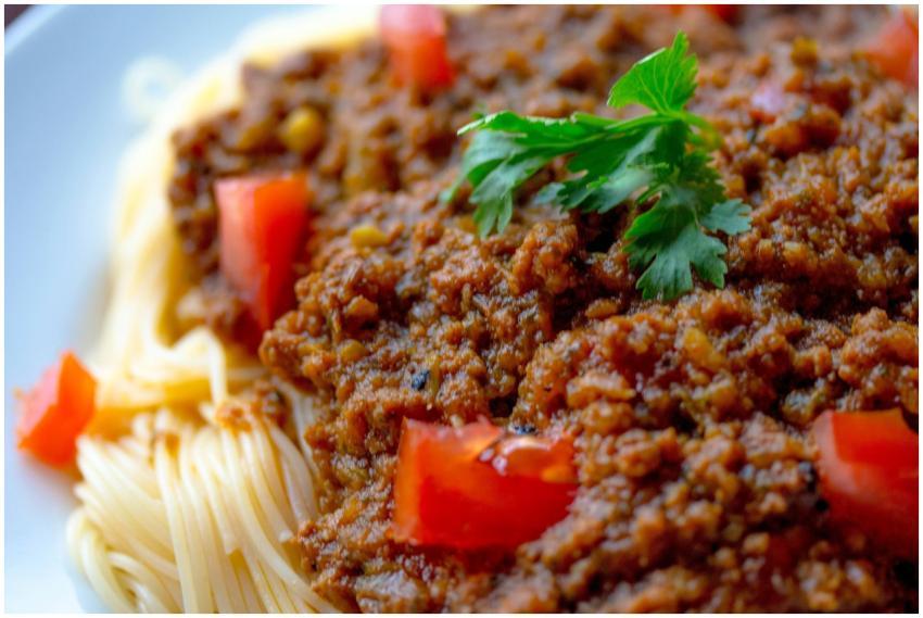 Close-up of a tasty spaghetti Bolognese topped wit