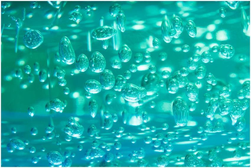 Close-up of vibrant bubbles underwater creating ab