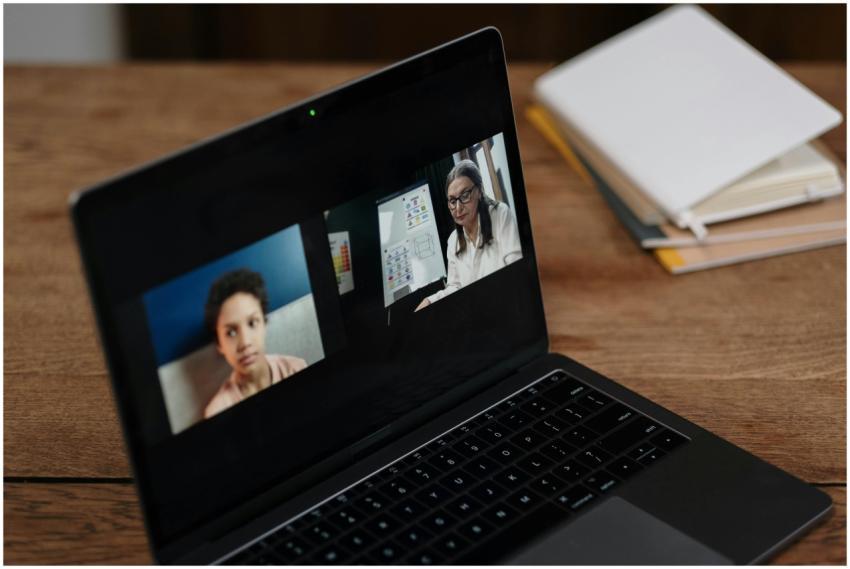 Two people engaging in online education via a lapt