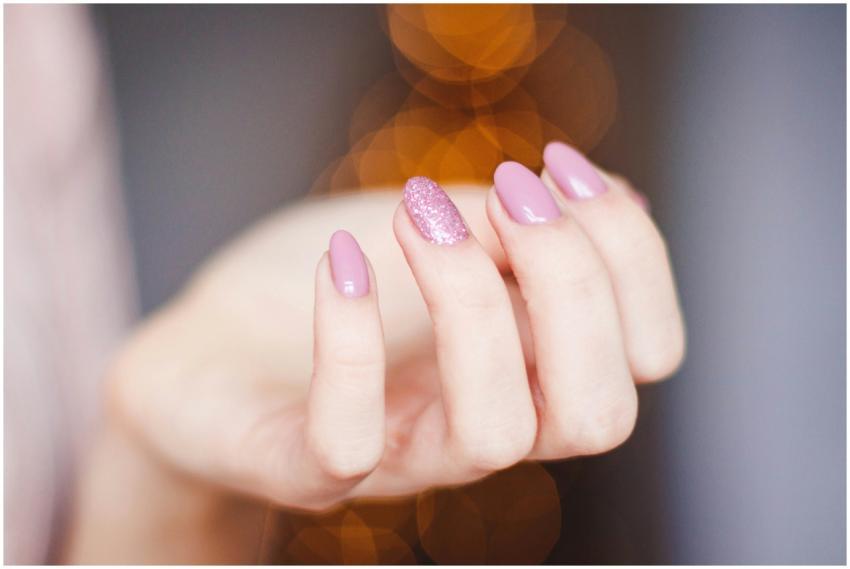 A close-up of a woman's hand displaying a stylish