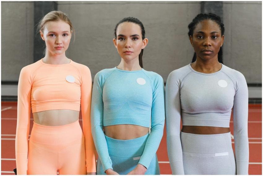 Three women posing confidently in vibrant activewe