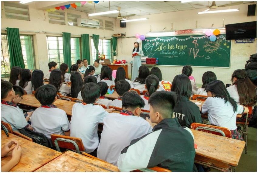 Students attentively listen to a teacher in a vibr