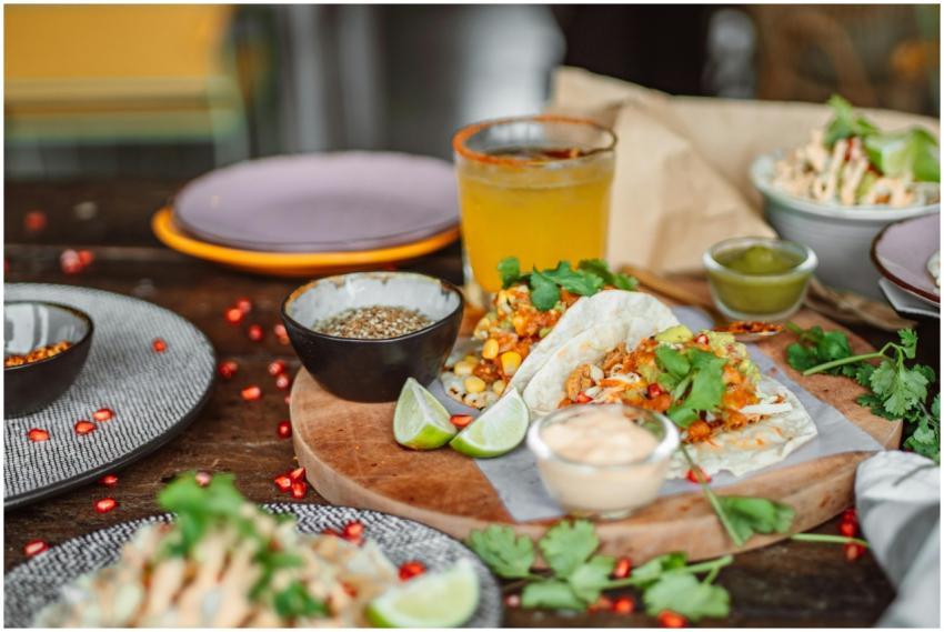 Delicious Mexican tacos served with lime, cilantro