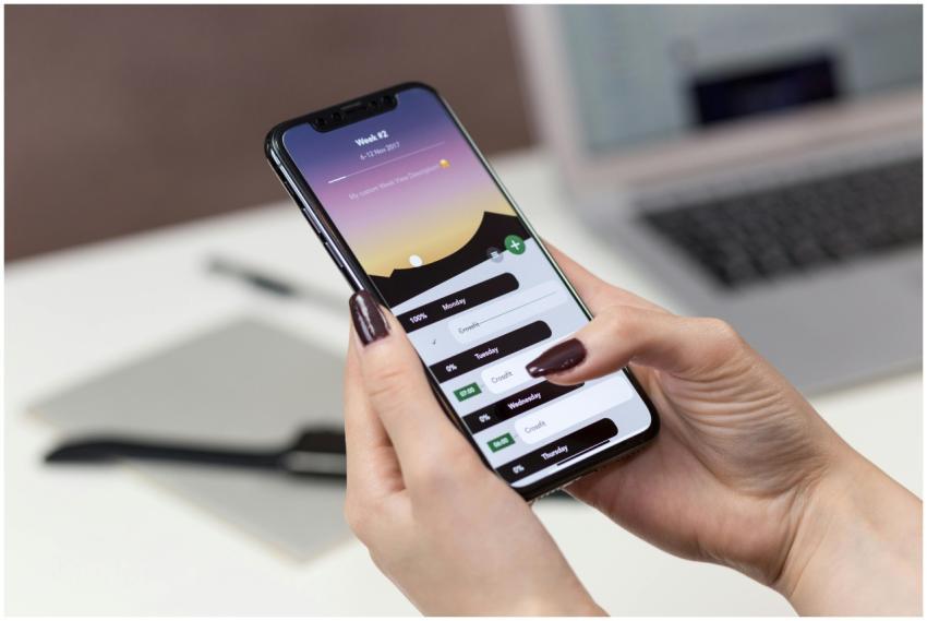A woman interacts with a productivity app on her s
