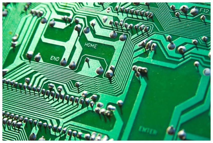 Detailed view of green circuit board with visible