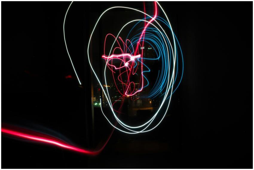A vibrant display of red and blue light trails aga