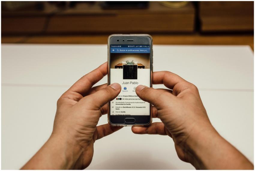 Close-up of hands using a smartphone with a social