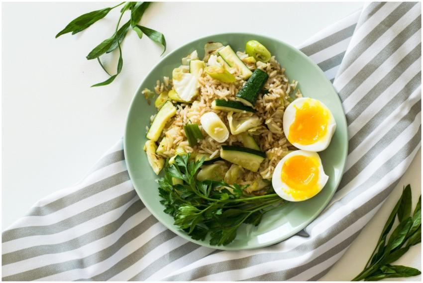 Delicious rice meal with zucchini, greens, and sof
