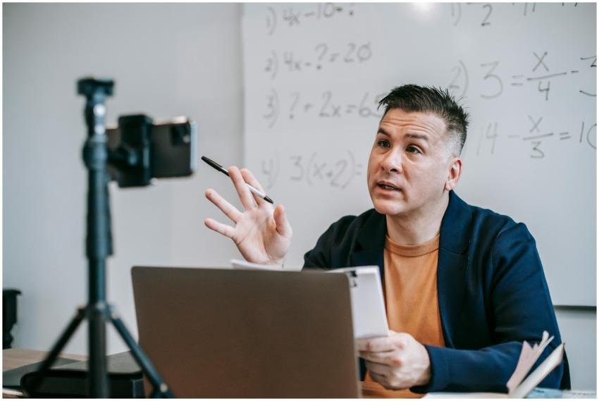 Instructor teaching math online using laptop and w