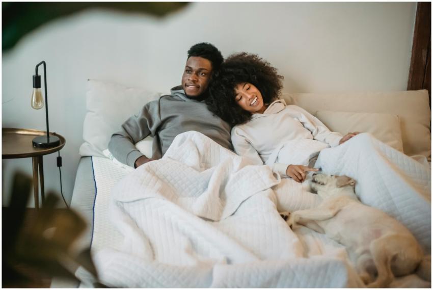 A couple enjoys a relaxing moment with their dog i