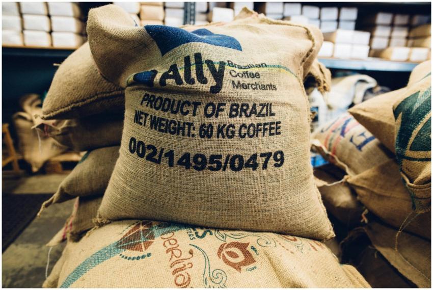 Stack of Brazilian coffee bags in a warehouse, hig