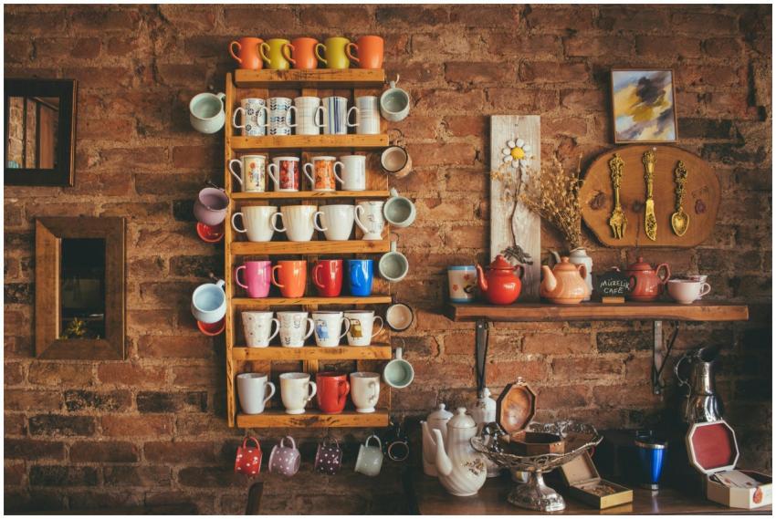 A collection of colorful vintage mugs and teapots