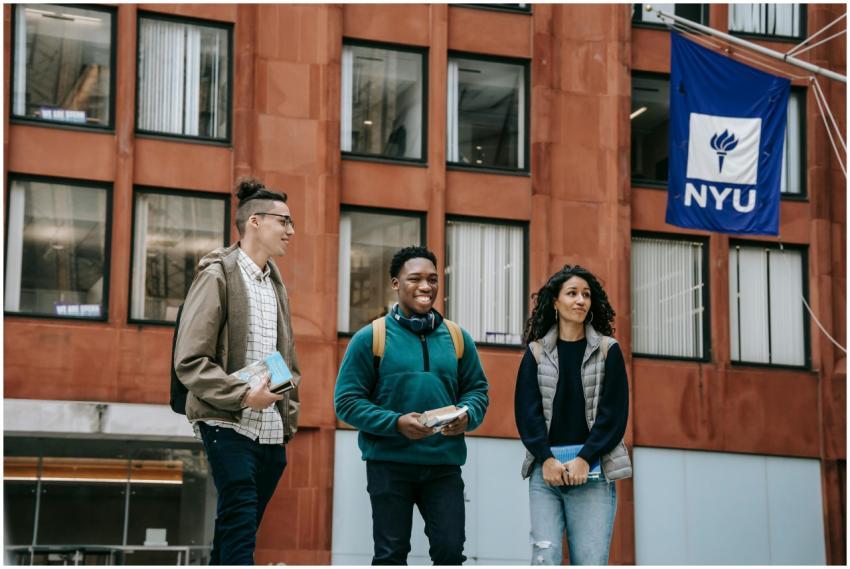 Group of happy multiracial friends with backpacks