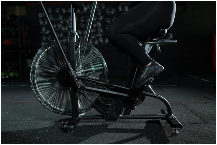 Close-up of a woman exercising on a stationary bik