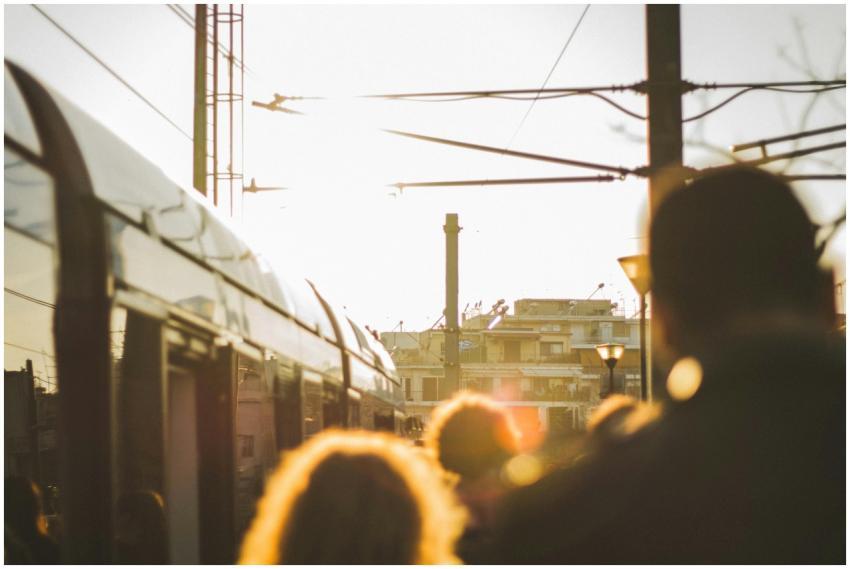 Sunlit scene of people waiting for a train in Athe