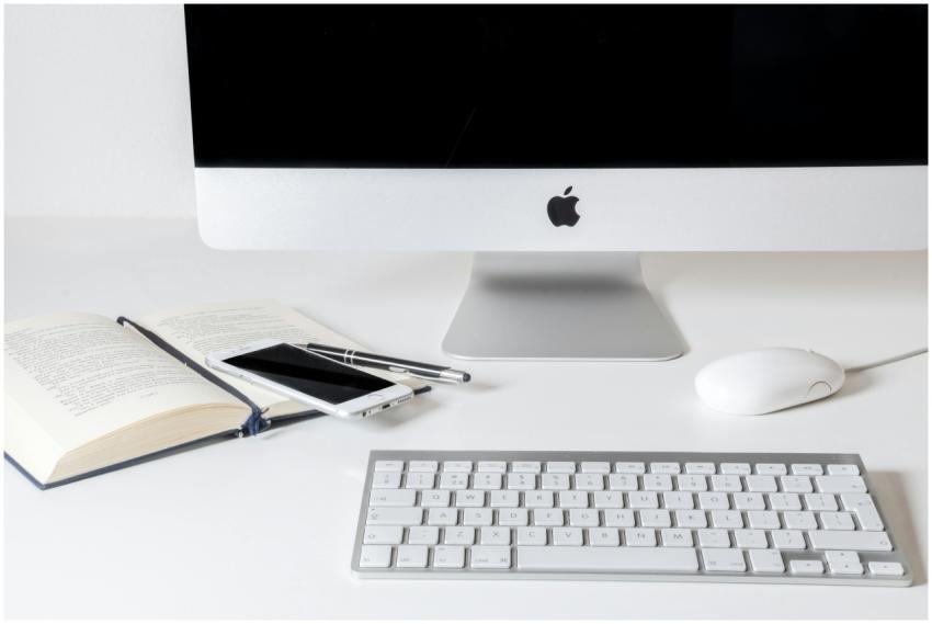 A sleek office desktop with computer, keyboard, an
