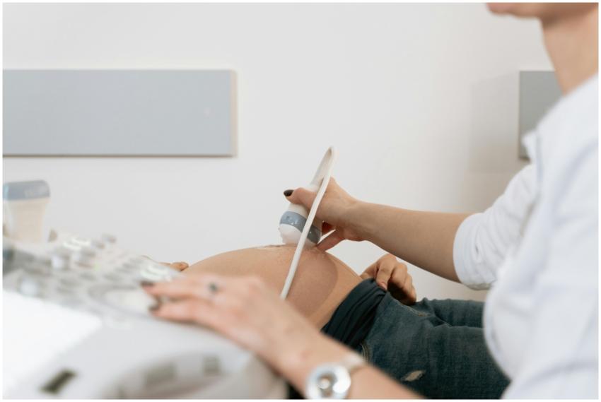 A healthcare professional performs an ultrasound o