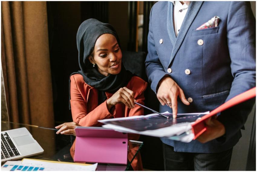 Business professionals in a meeting discussing doc