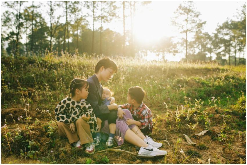 A mother with her three children enjoying a sunny