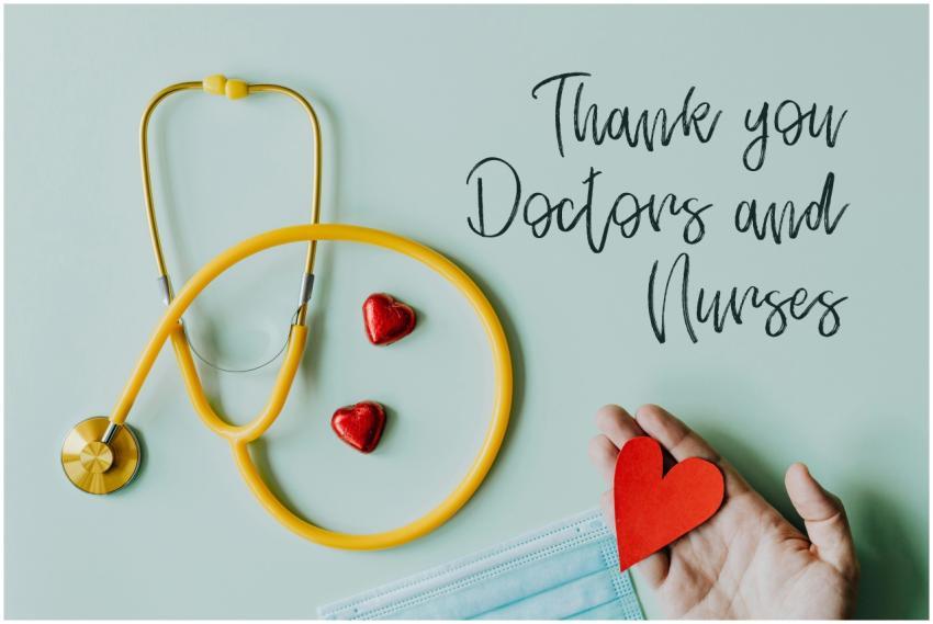 Yellow stethoscope composed with red hearts on whi