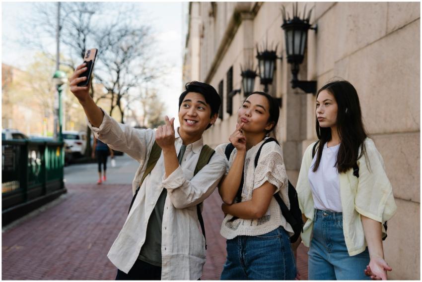 A group of young adults enjoying a selfie together