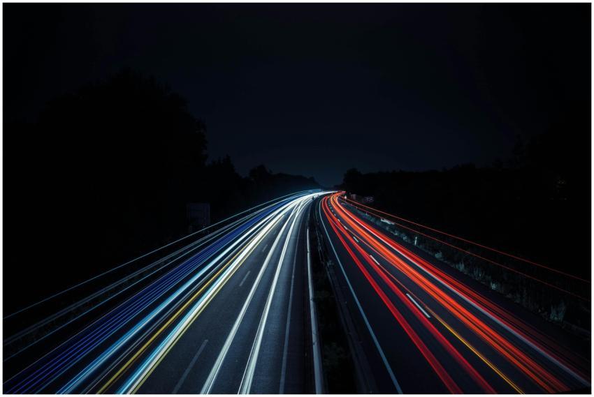 Long exposure photo of vibrant light trails on a h