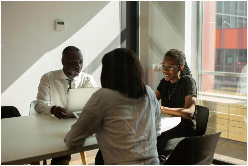 Three professionals engaged in a productive meetin