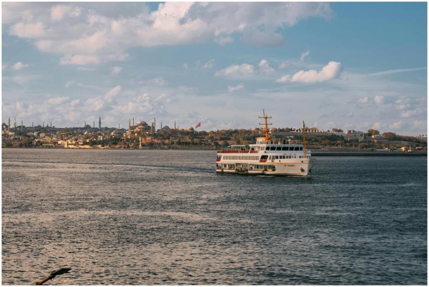 Ferry navigating the Bosphorus with Istanbul skyli