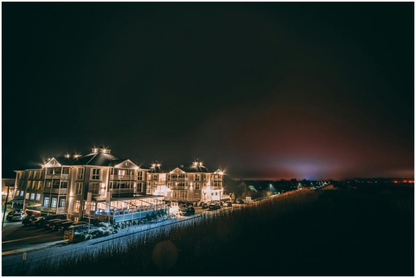 A beautifully illuminated hotel building at night