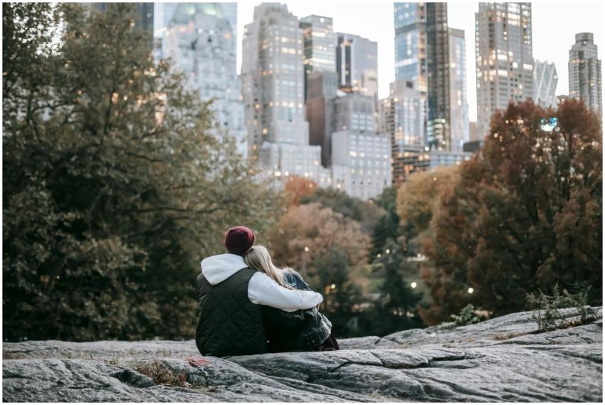 Couple enjoying a tender moment on a rocky outcrop