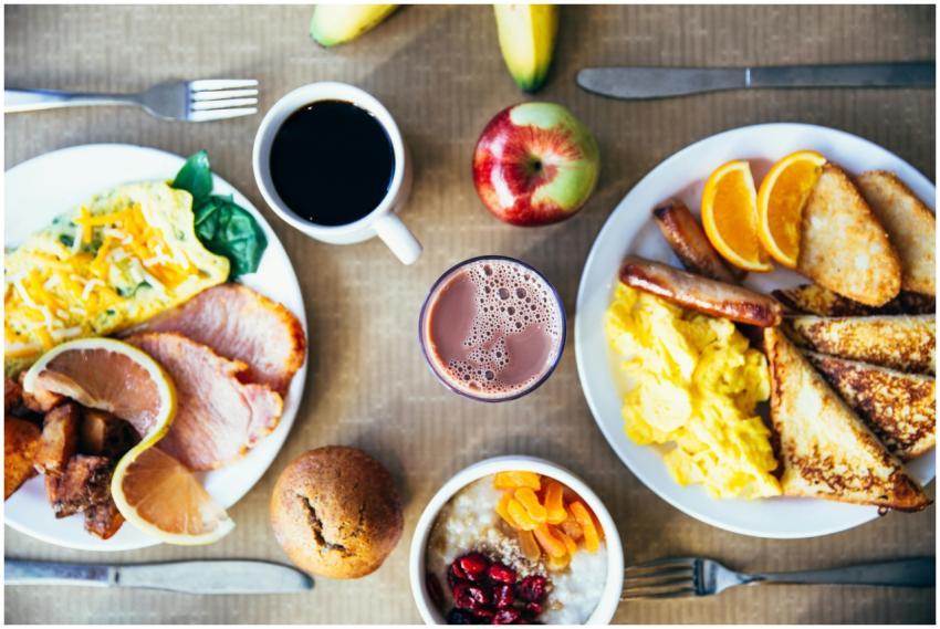 Vibrant breakfast with eggs, fruits, toast, and co