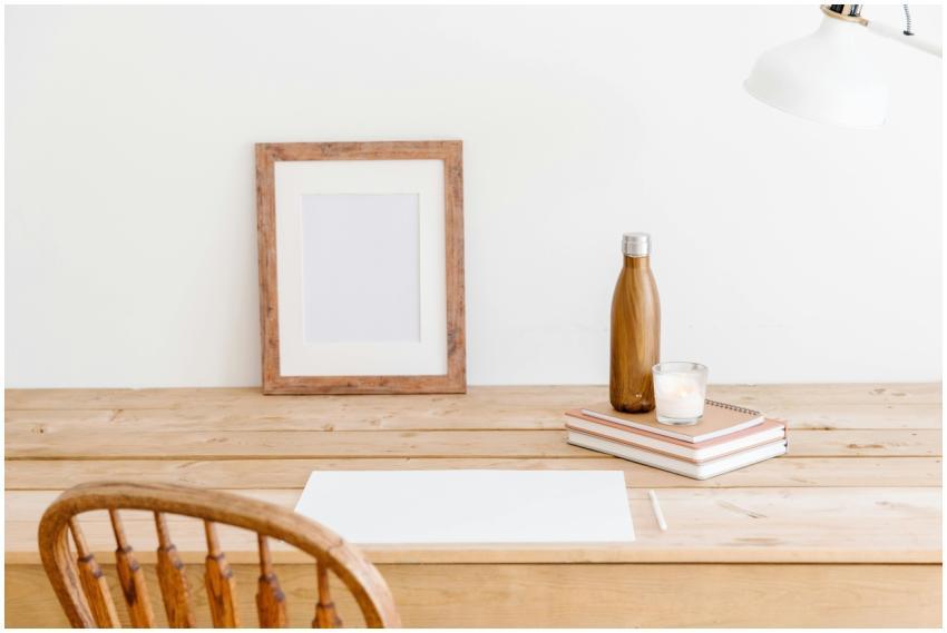 Minimalist workspace featuring a wooden chair, des