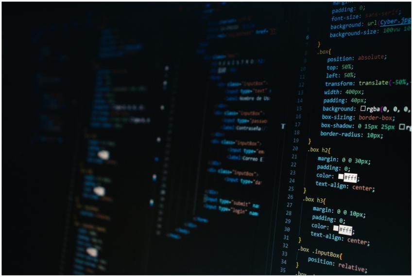 Detailed view of HTML and CSS code on a dark scree