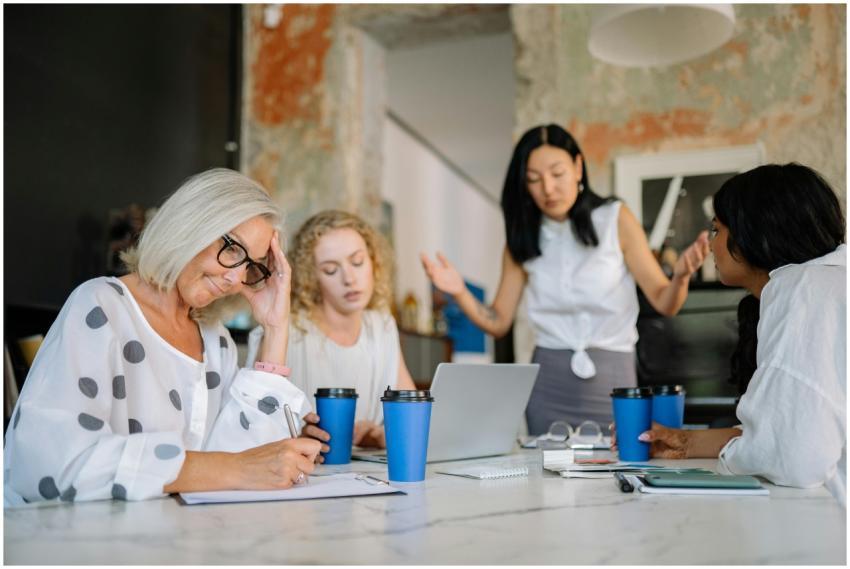 A business meeting with diverse women discussing a