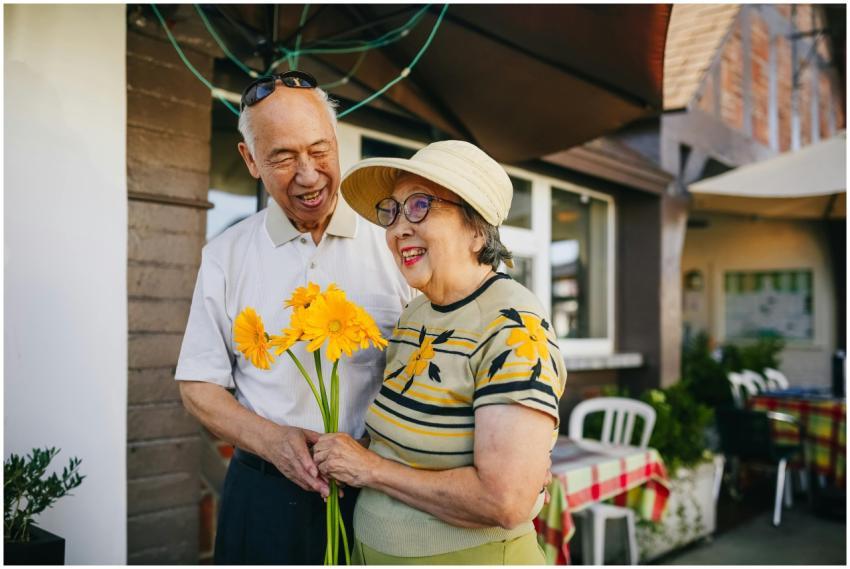 Happy senior couple enjoying a moment with yellow