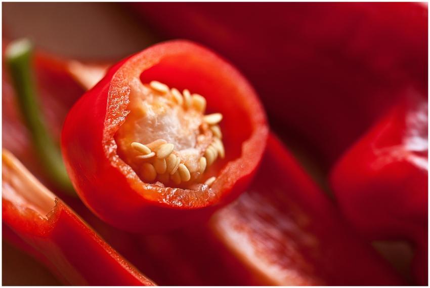 Macro photograph of sliced red chili peppers showi